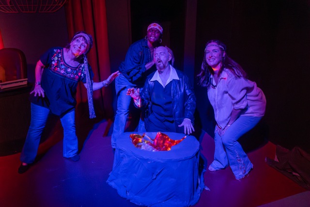 The ensemble of witches – Barbara Schapiro, Caroline Kautsire, and Kaci Foster – along with lead Christian Roulleau, perform during “Macbeth” at the Mass Arts Center, Nov. 1-10, 2024. The production and individual cast and crew members are nominated for several DASH awards from the Eastern Massachusetts Association of Community Theatres (EMACT). Photo by Stephen Ide/The Mass Arts Center